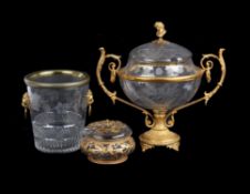 A French engraved clear glass and gilt metal mounted twin-handled pedestal punch bowl and cover