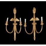 A pair of carved and gilded two branch wall lights in mid-18th century manner