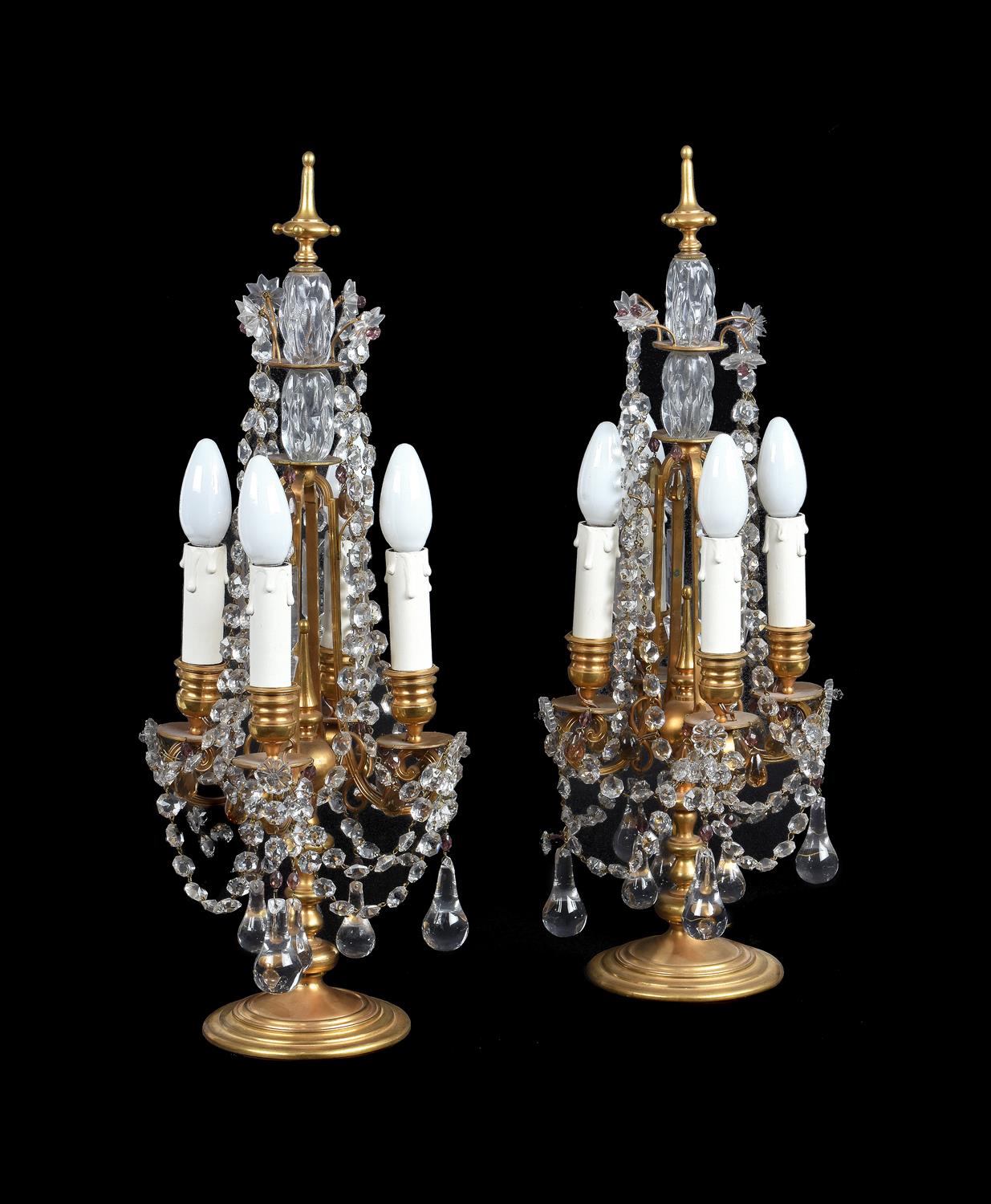 A pair of gilt brass and four light candelabra fitted as table lamps