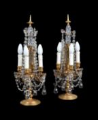 A pair of gilt brass and four light candelabra fitted as table lamps