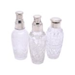 Three silver mounted cut glass cocktail shakers