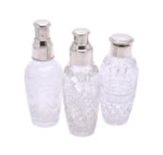 Three silver mounted cut glass cocktail shakers