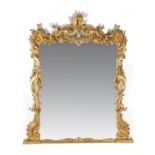 A carved giltwood overmantel mirror