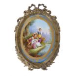 A French porcelain Sevres-style gilt-metal mounted oval wall-plaque