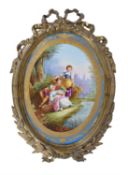 A French porcelain Sevres-style gilt-metal mounted oval wall-plaque