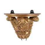 A carved giltwood wall bracket