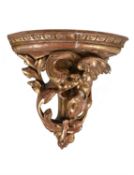 A Gothic Revival carved and giltwood corner bracket