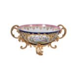 A French porcelain and gilt metal mounted twin-handled bowl