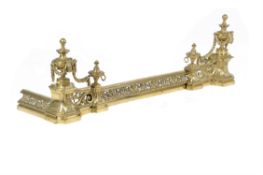 A brass fire fender in Louis XVI style