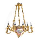 A Napoleon III gilt bronze and Sevres-style porcelain nine light chandelier