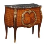 Y A French mahogany kingwood, parquetry, and gilt metal mounted commode in Louis XV style
