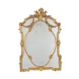 A giltwood and composition wall mirror in the Rococo style