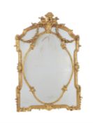 A giltwood and composition wall mirror in the Rococo style