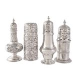 Four silver sugar casters comprising: an ogee baluster by Stokes & Ireland Ltd