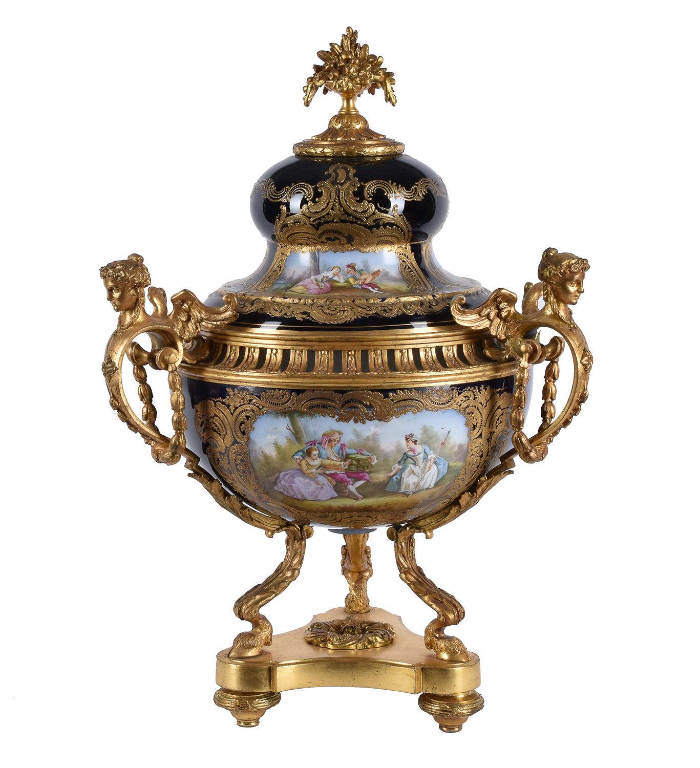 A Sevres-style porcelain blue-ground and gilt-metal mounted three-handled pot pourri urn and cover