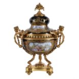 A Sevres-style porcelain blue-ground and gilt-metal mounted three-handled pot pourri urn and cover