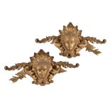 A pair of carved giltwood wall plaques in 18th century style