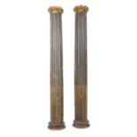 A pair of painted oak columns in the Ionic order