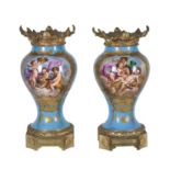 A pair of French porcelain Sevres style gilt-metal mounted inverted baluster vases