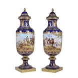 A pair of Sevres style pottery gilt-metal mounted vases and covers decorated in the Imperial manner