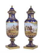 A pair of Sevres style pottery gilt-metal mounted vases and covers decorated in the Imperial manner