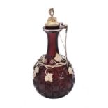 A late Victorian silver gilt mounted ruby glass claret jug by Elkington & Co.