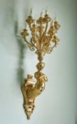 A pair of substantial French gilt-metal ten light wall appliques in Empire style