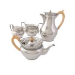 Y A silver baluster four piece tea service by C. S. Harris & Sons Ltd
