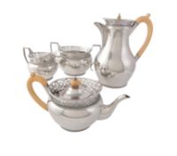 Y A silver baluster four piece tea service by C. S. Harris & Sons Ltd