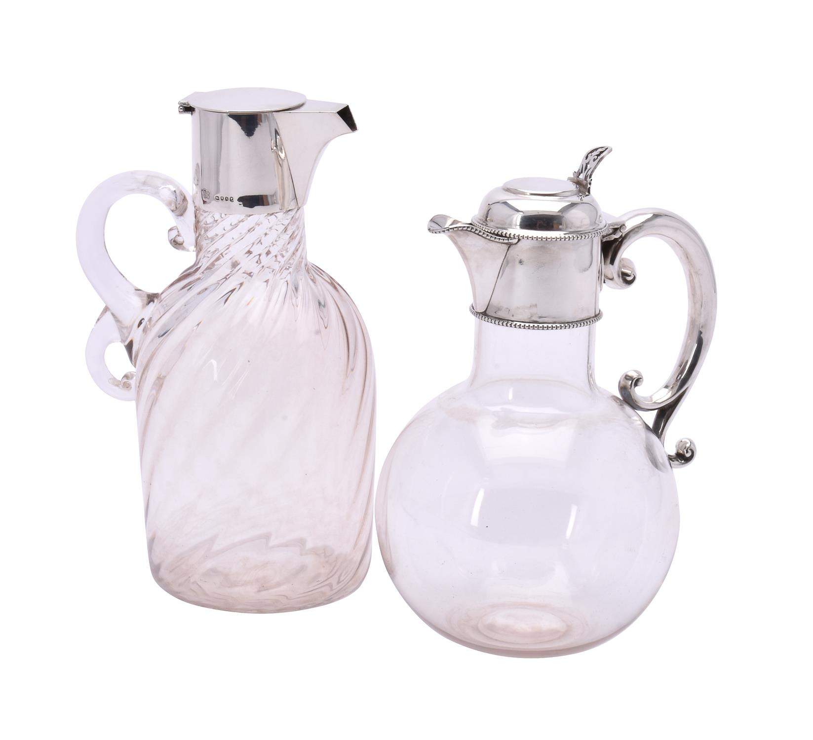 Two Victorian silver mounted clear glass decanters