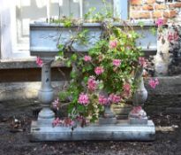 A white painted reconstituted stone planter in the 17th century taste