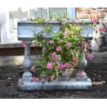 A white painted reconstituted stone planter in the 17th century taste