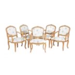 A set of ten carved beech wood elbow chairs