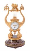 Y A French gilt metal and tortoiseshell timepiece in early 19th century style