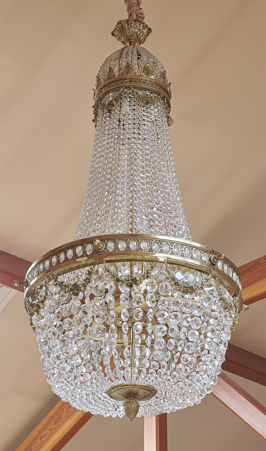 A substantial gilt metal and cut and moulded glass chandelier