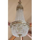 A substantial gilt metal and cut and moulded glass chandelier