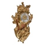 A Louis XV style gilt brass cartel clock