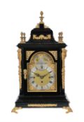 An Edwardian ebonised and gilt-metal mounted quarter chiming bracket clock