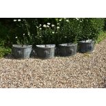 A set of four painted metal planters in 18th Century style