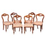 A set of twelve Victorian mahogany dining chairs