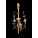 A set of four giltwood and gesso three branch wall lights