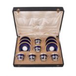 A set of six Edwardian silver coffee cup holders by Mappin & Webb