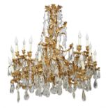 A substantial French gilt bronze and cut glass twenty-four light chandelier in Louis XV style