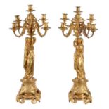 A pair of Napoleon III ormolu nine light figural candelabra