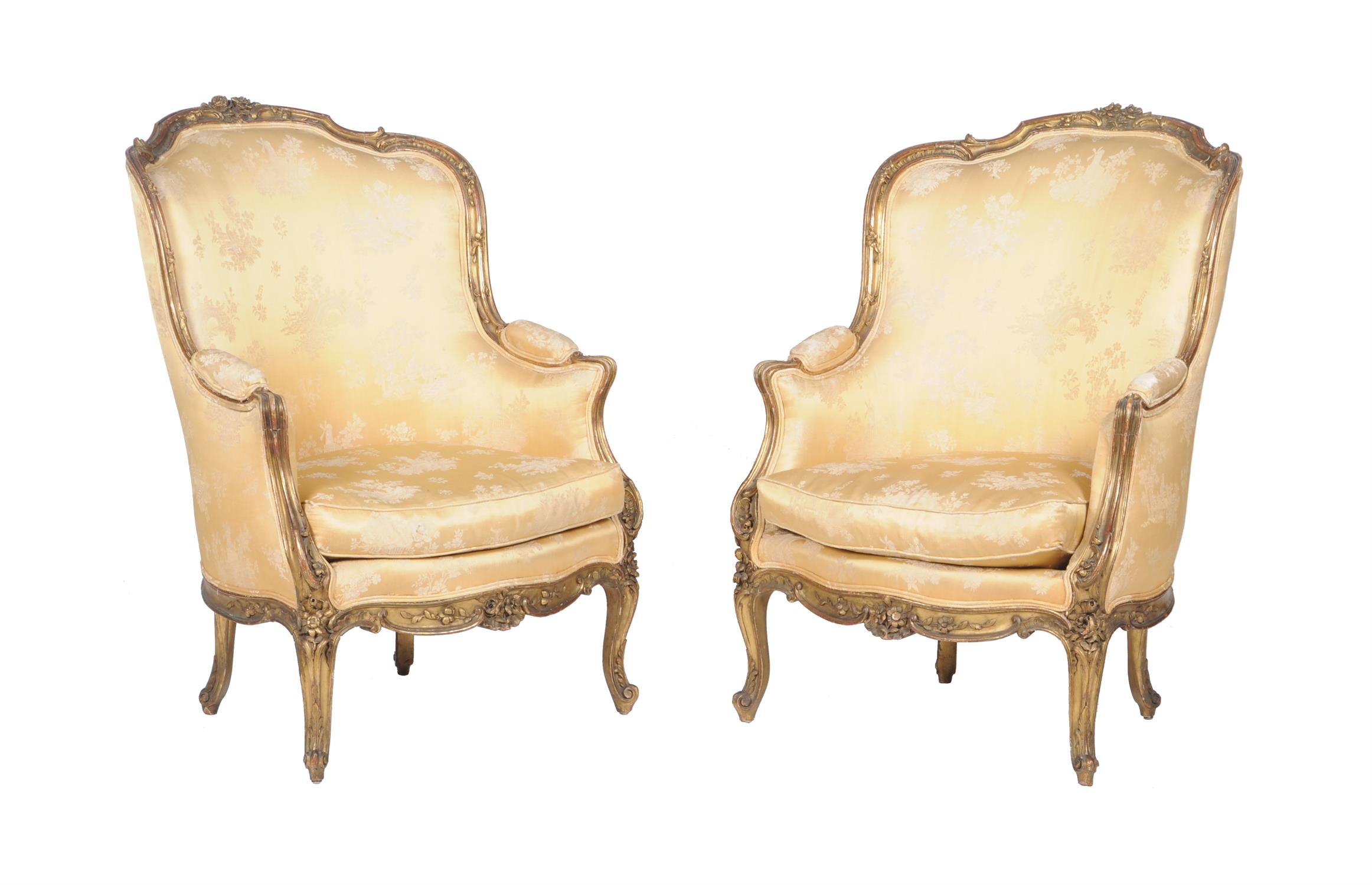 A pair of gilt framed fauteuils in the Louis XVI style