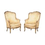 A pair of gilt framed fauteuils in the Louis XVI style