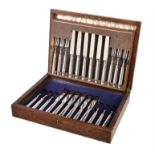 A set of twelve silver fruit knives and forks by Tessiers Ltd