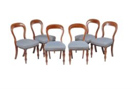 A set of twelve Victorian mahogany dining chairs