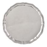 A silver shaped circular salver by Carrington & Co.