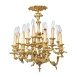 A French gilt bronze twelve light chandelier in Louis XV style